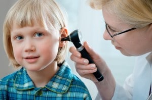 examining childs ear for hearing loss